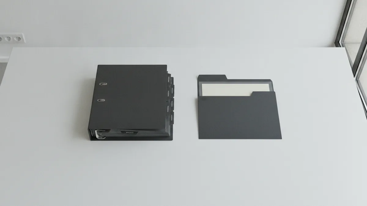 Organized binder and tabs representing a structured approach to franchise planning.