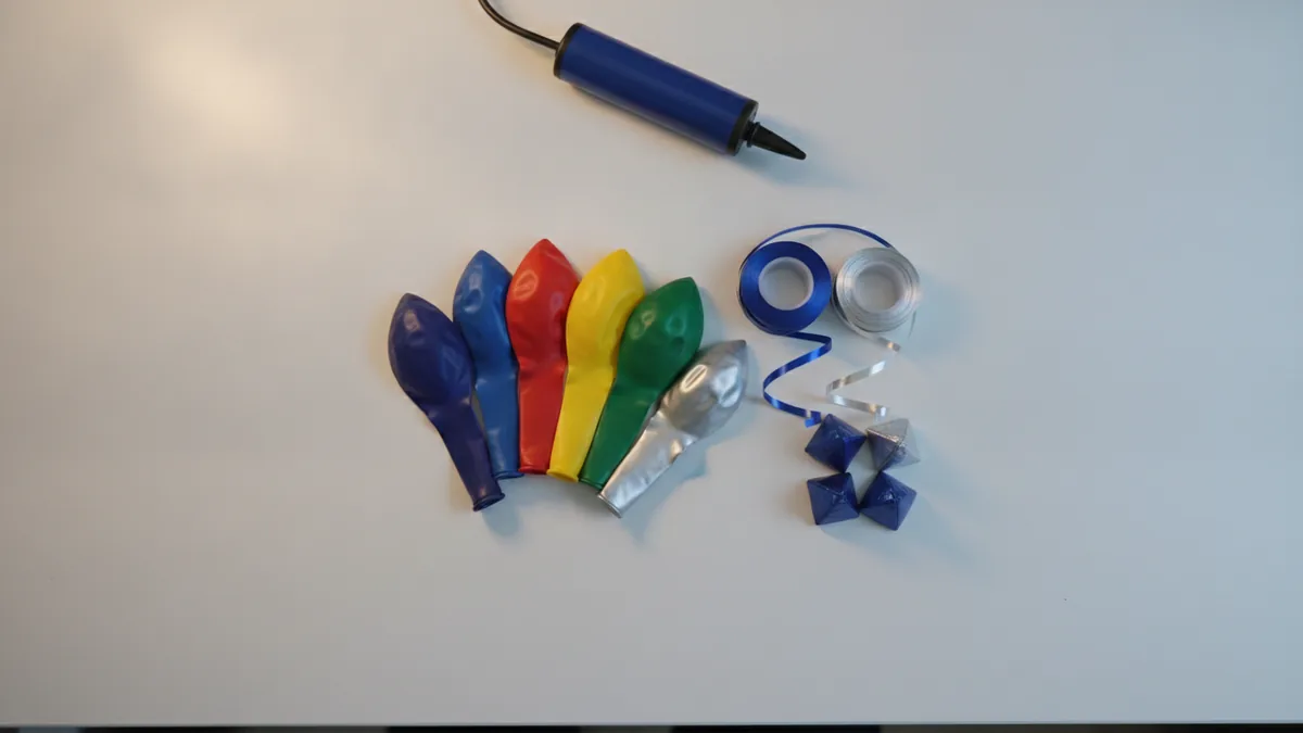 Balloon supplies laid out on a workbench for planning