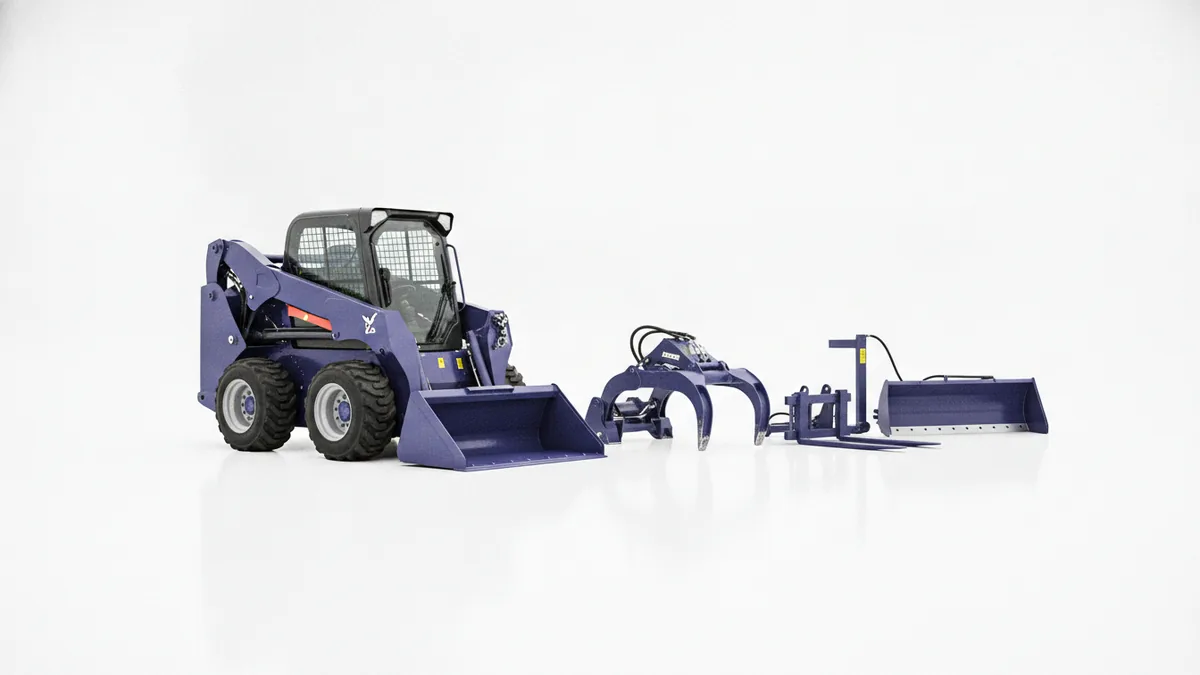 Skid steer and attachments arranged at a clean equipment yard