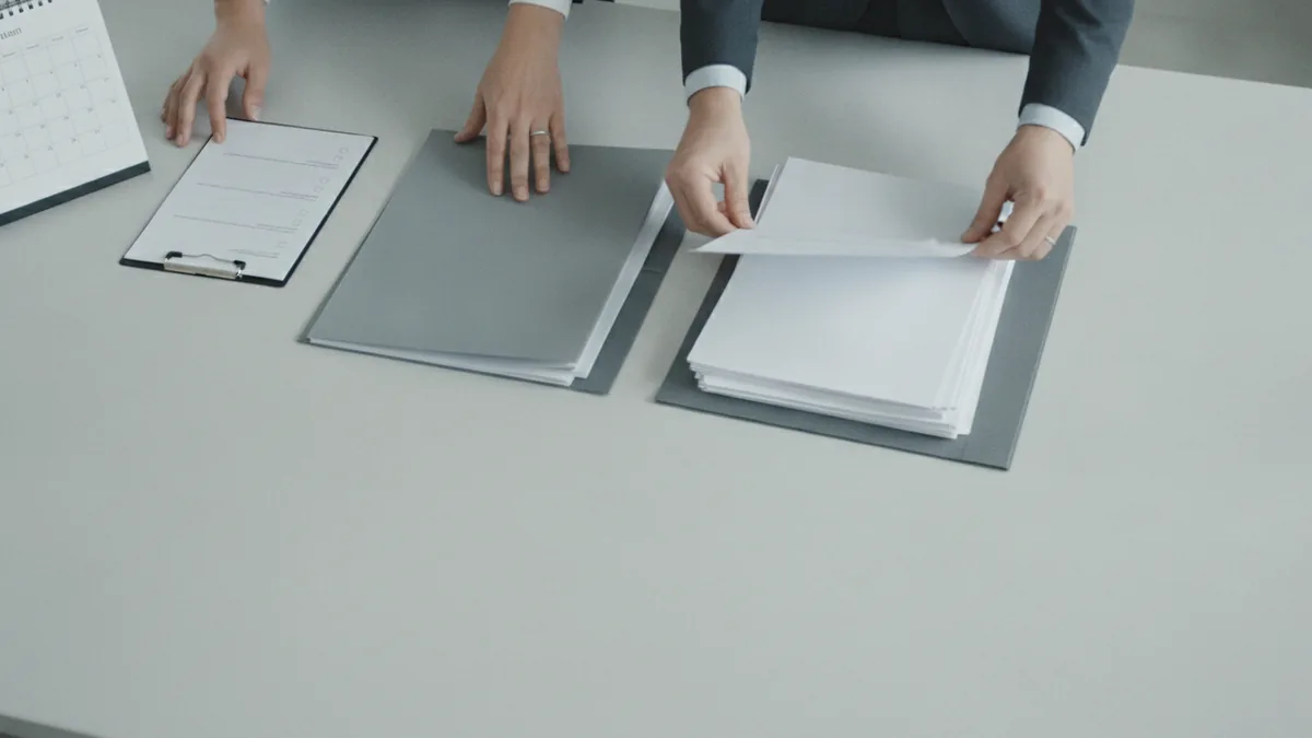What tax preparers do Hands organizing tax documents alongside a checklist and calendar