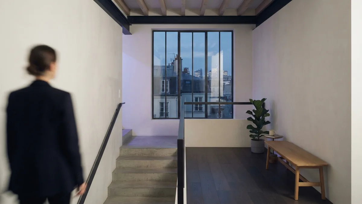 A completed loft conversion Finished loft room with a stair landing, pale walls, and clean roof lines